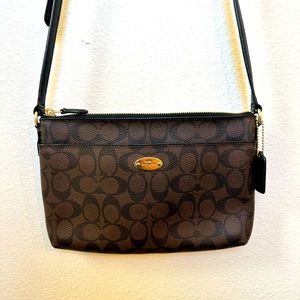 COACH Crossbody in Signature coated canvas and leather.